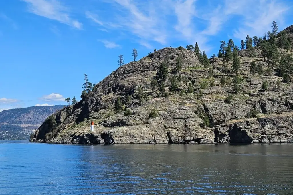 Rocky island bluff and clear water on Okanagan Lake
