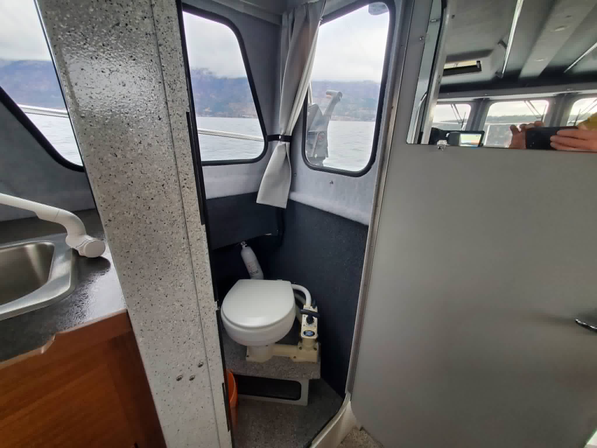 Enclosed head (bathroom) onboard the charter boat