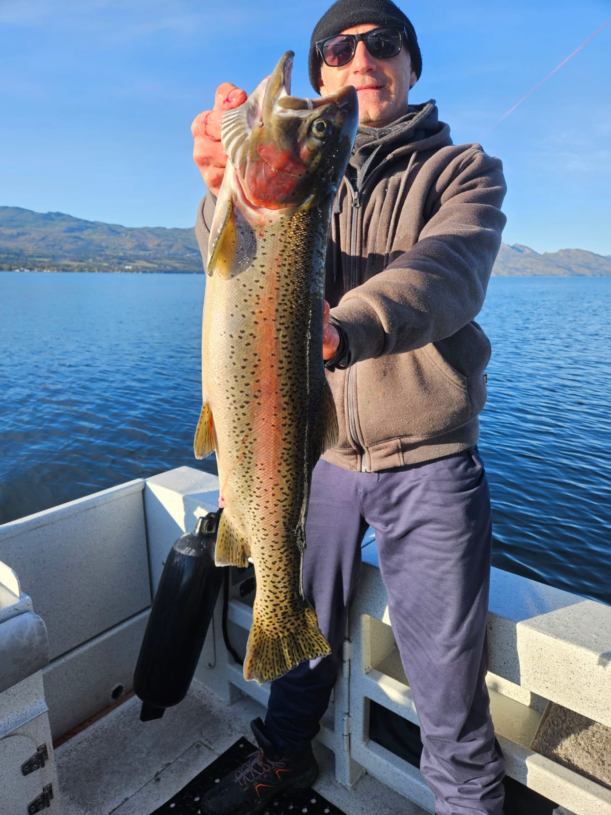 Guest with a trophy rainbow trout — Outdoor Adventures BC